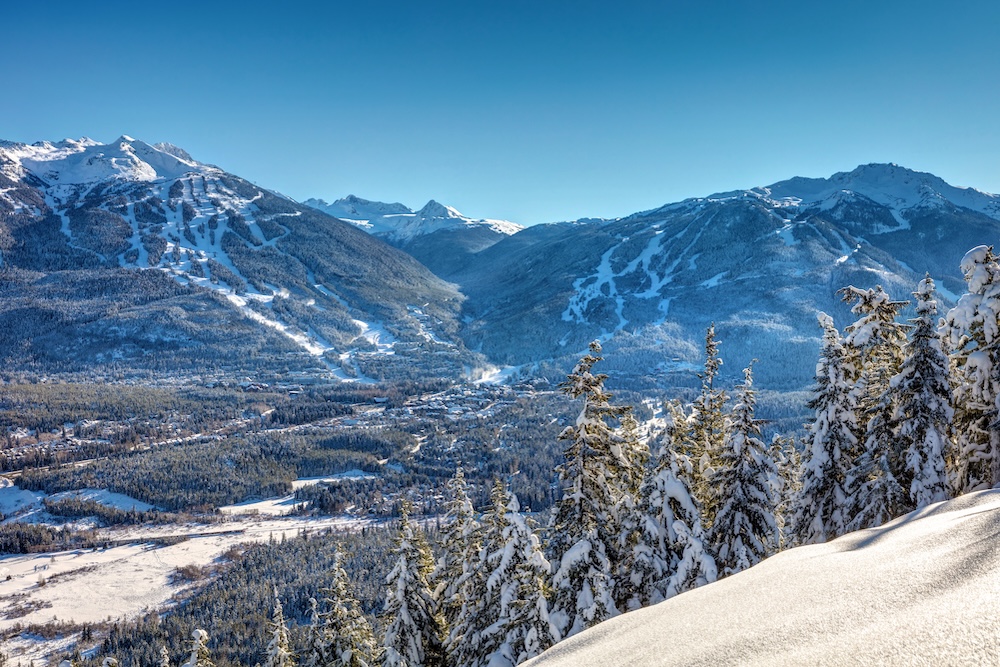 Whistler Blackcomb Mountains in Winter after a fresh snowfall on a sunny blue sky day. British Columbia, Canada 